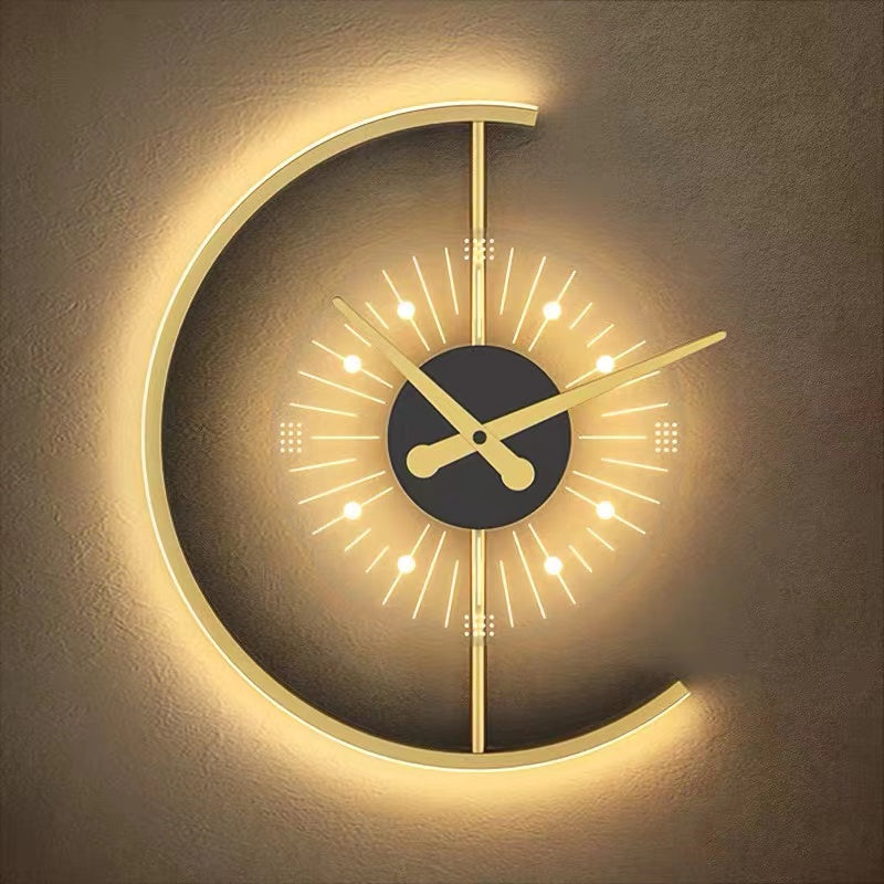 Close view of Nielsen’s lit gold-tone open arc, black centre, gold-tone hands and radial dial markings