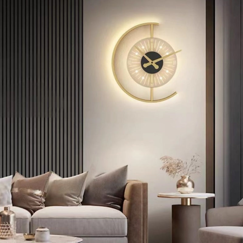 Nielsen clock wall light with an illuminated outer arc above a living-room sofa and side table