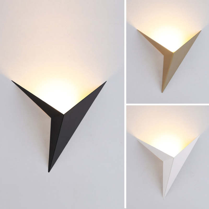 Orr colour comparison showing illuminated black, gold and white triangular lamps