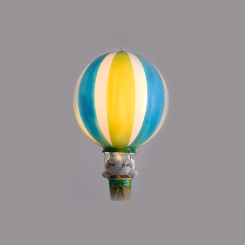 C-type blue and yellow striped balloon pendant with a cat toy pictured above its green-rimmed basket