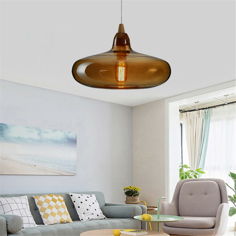 Broad Hailie amber pendant above a living-room sofa and chair