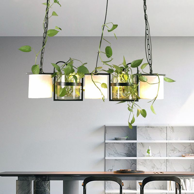Nest greenery pendant above a counter in front of a mirror
