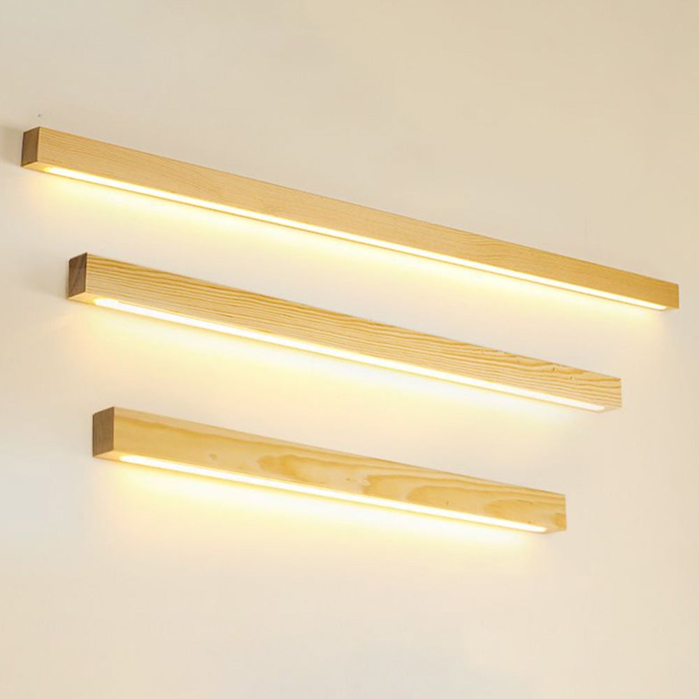 Three separate pale wood-grain wall bars of different lengths arranged above one another with downward glow