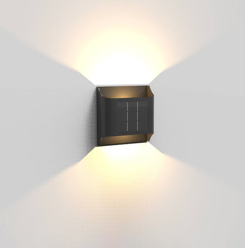 Compact black Orr fixture with broad warm up-down beams
