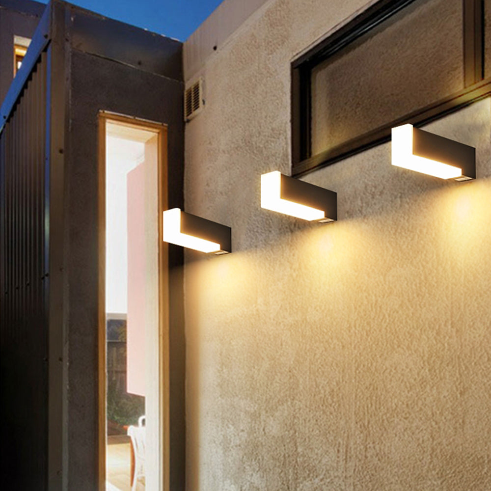Three separate horizontal Orr wall lights beside windows and doors
