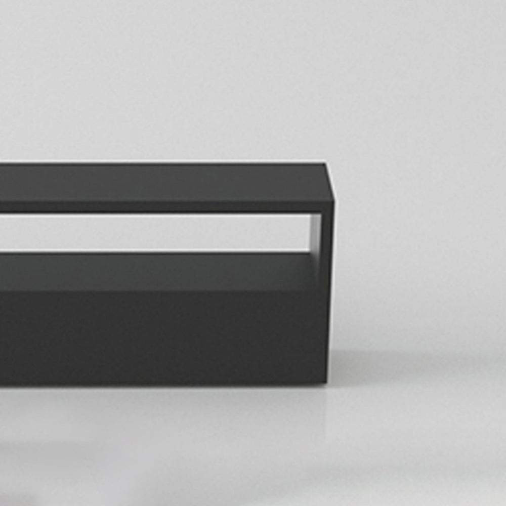 Close-up of an unlit black rectangular frame arranged horizontally, with its pale inner strip visible