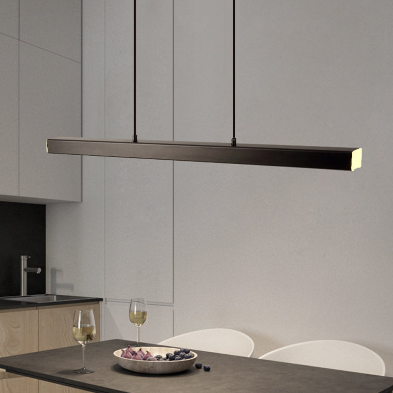 Black Edge bar above dark table with wine glasses and fruit plate, white chairs and kitchen sink at left