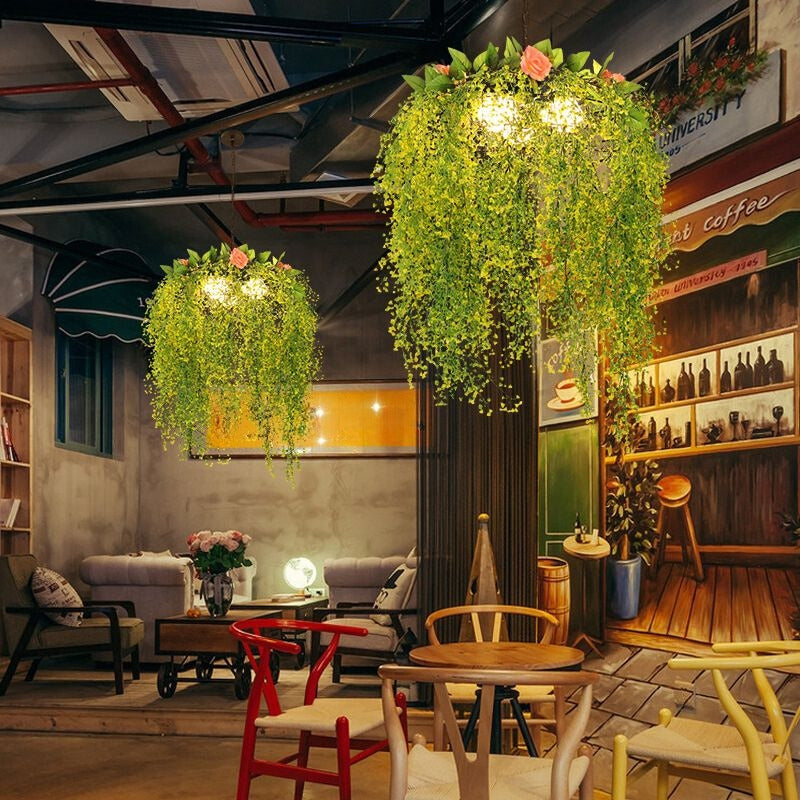 Green decorative pendants above tables in a cafe interior