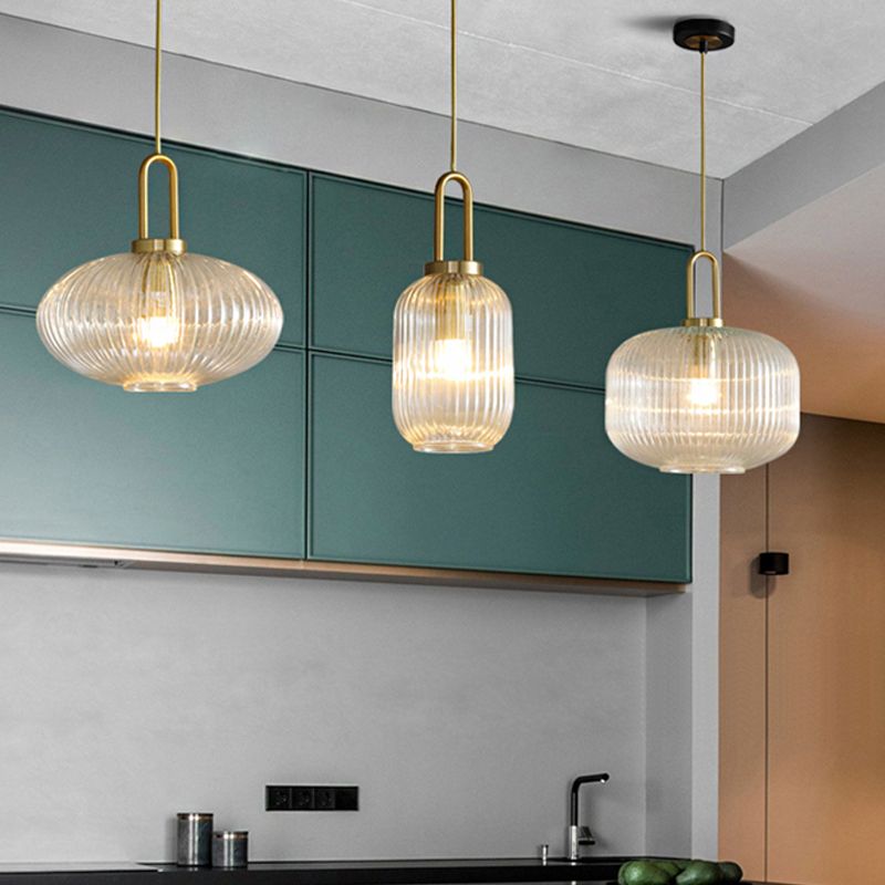 Three Sanna clear ribbed glass shape options over kitchen counter