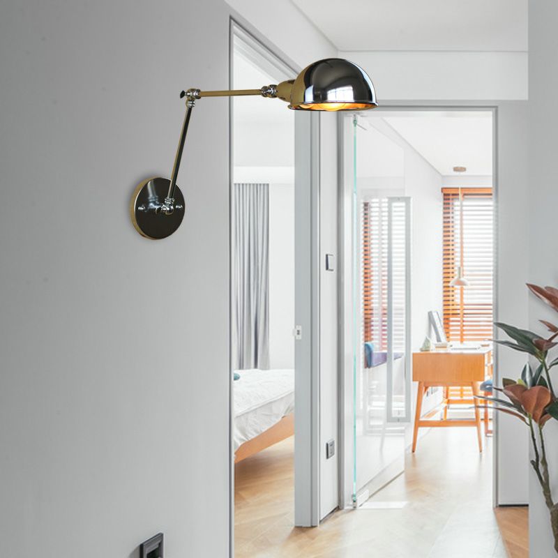 Chrome dome wall lamp on an extended jointed arm