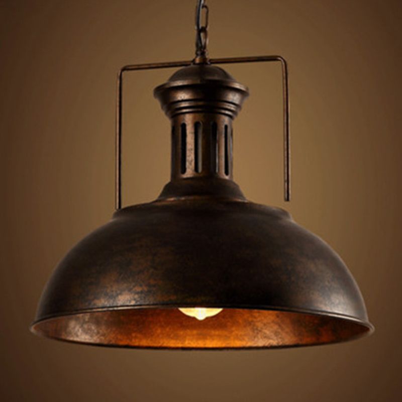Rust-finish Alessio dome pendant with a textured brown exterior, warm-looking interior and visible lit bulb