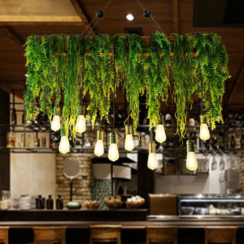 Illuminated Nest foliage pendant over a café bar.