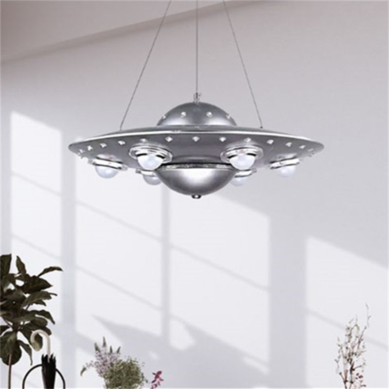 Alessio silver saucer pendant casting shadows in a bright interior.