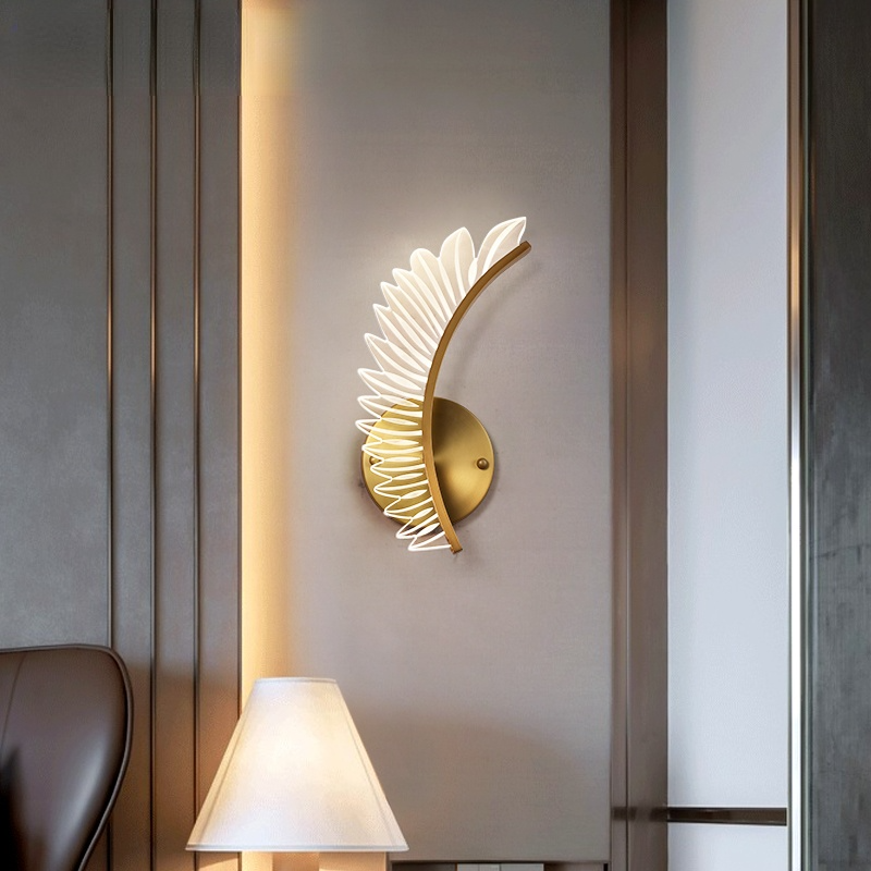 Kristy Left single-wing wall light above a table lamp and chair on a grey wall