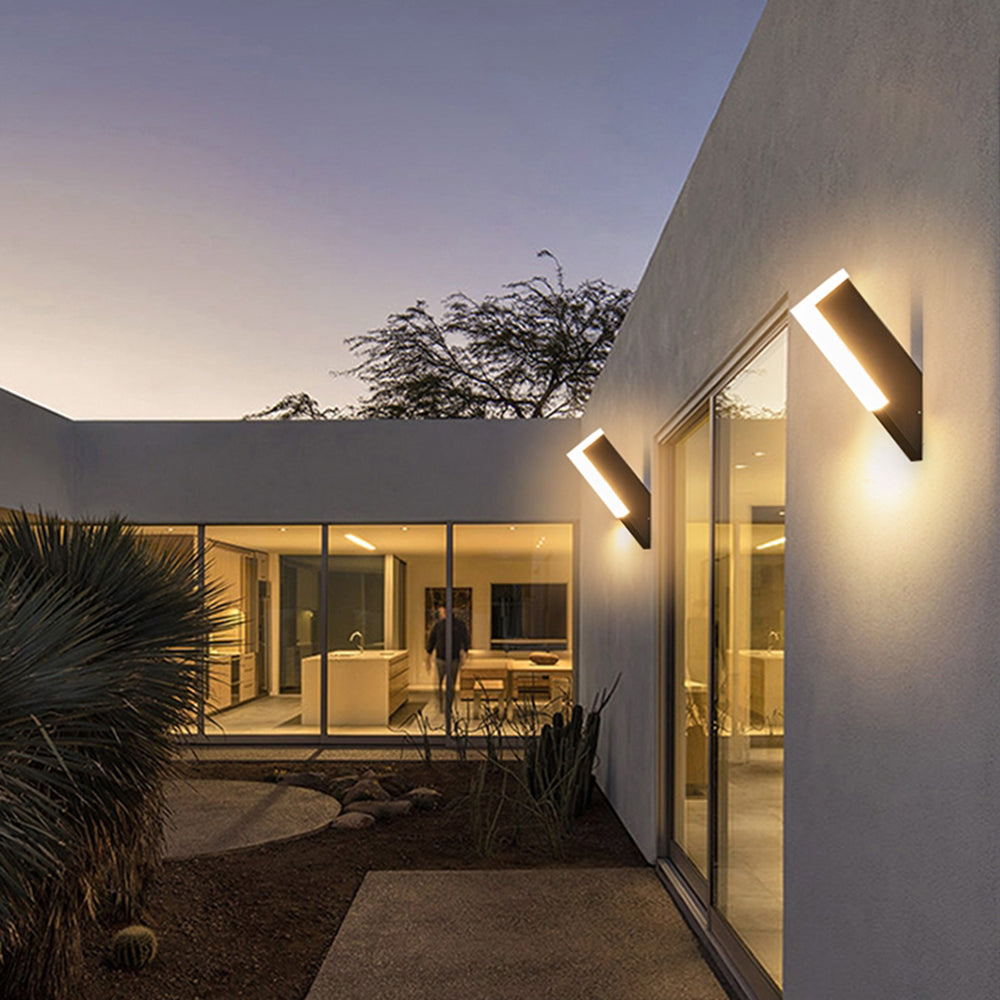 Angled Orr outdoor wall lights above a modern home walkway