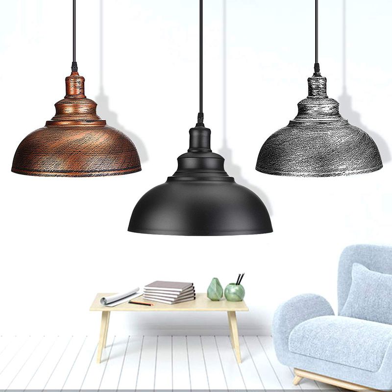 Copper, black and silver-gray dome pendants in a room scene