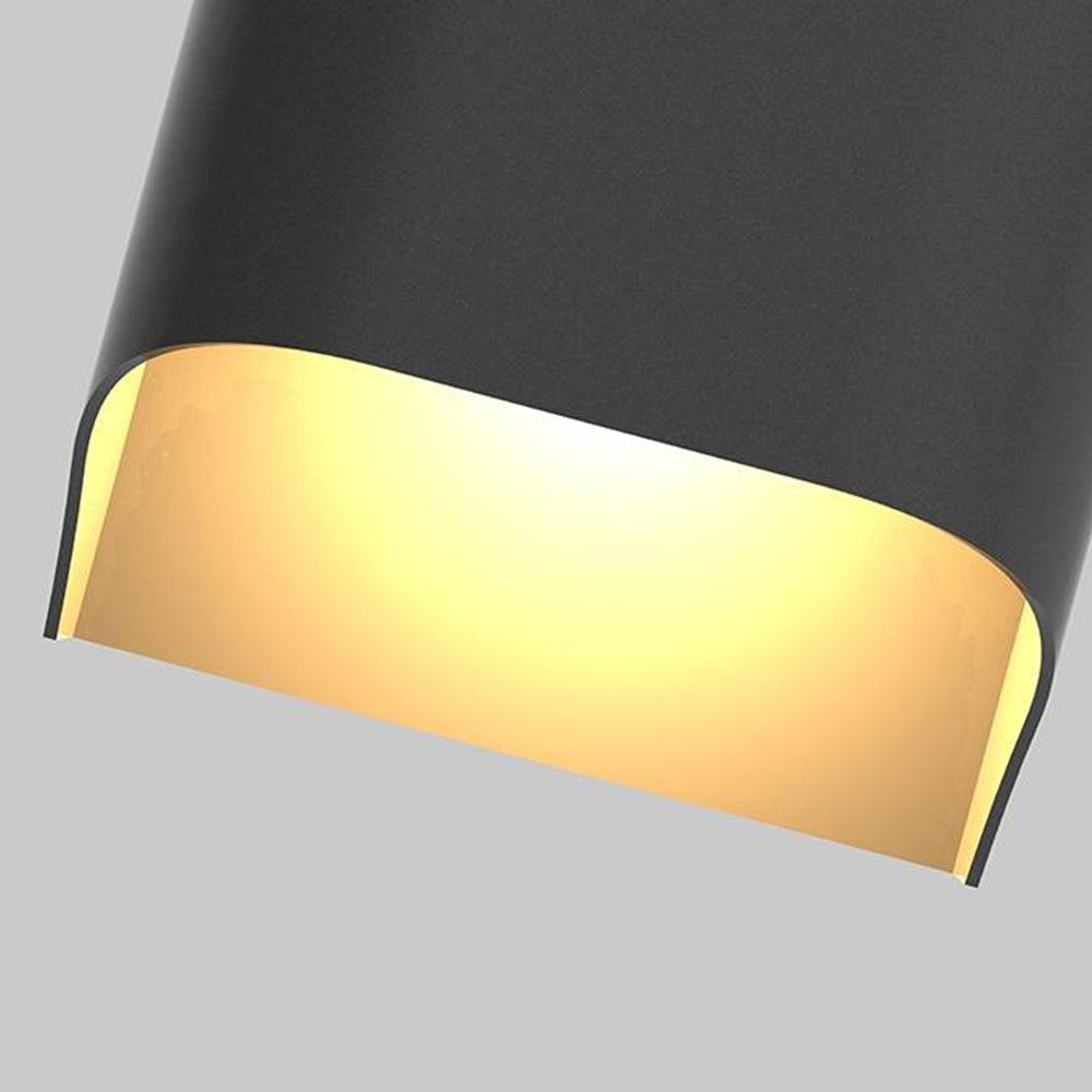 Close-up of the lower opening of a tall black Orr wall light