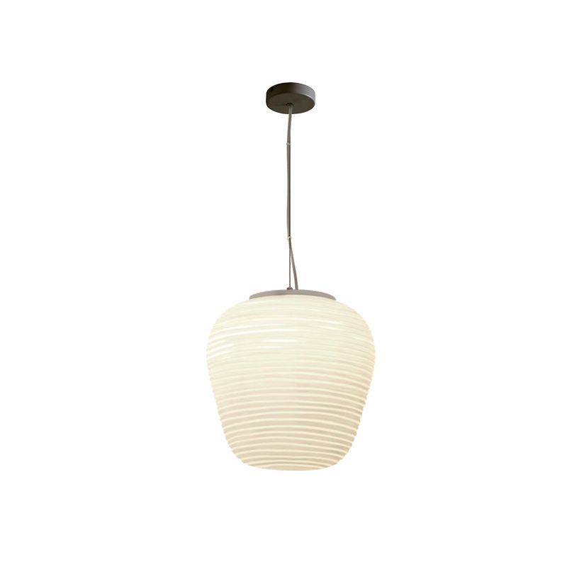 Short rounded ribbed white pendant illuminated on a white background with dark round canopy and cord