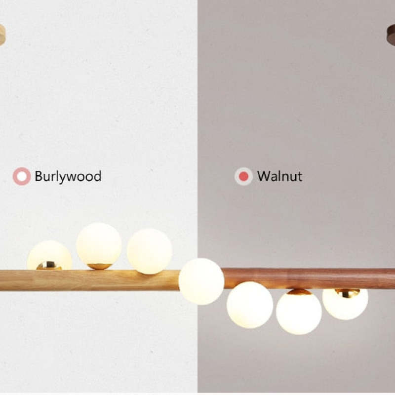 Split finish comparison labelled Burlywood and Walnut, showing light and Dark wood with White glass globes
