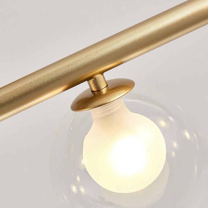 Close gold bar and glass collar with a clear outer globe around a bright white inner form