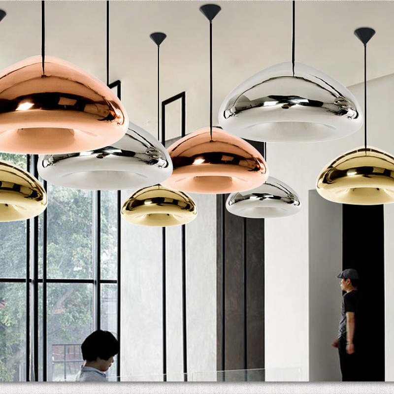 Mixed gold, silver and rose-gold pendants hanging at different heights
