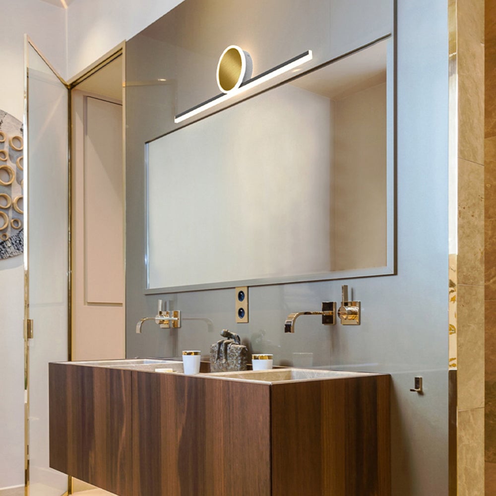 Emyr horizontal bar and gold-tone disc above a large mirror and double sink