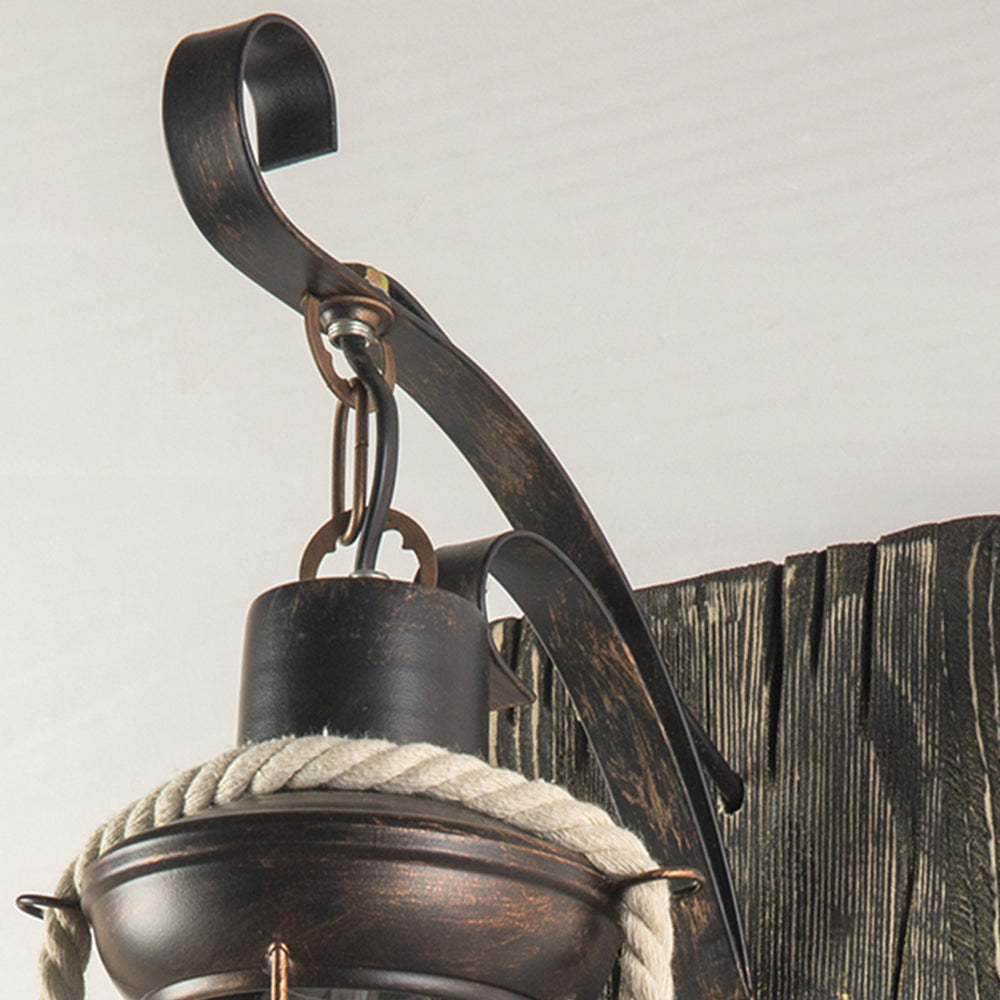 Alessio curved metal hook and rope-trimmed lantern cap close-up