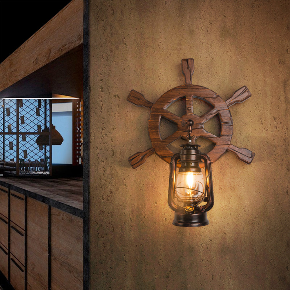 Illuminated Austin ship-wheel lantern against a textured wall