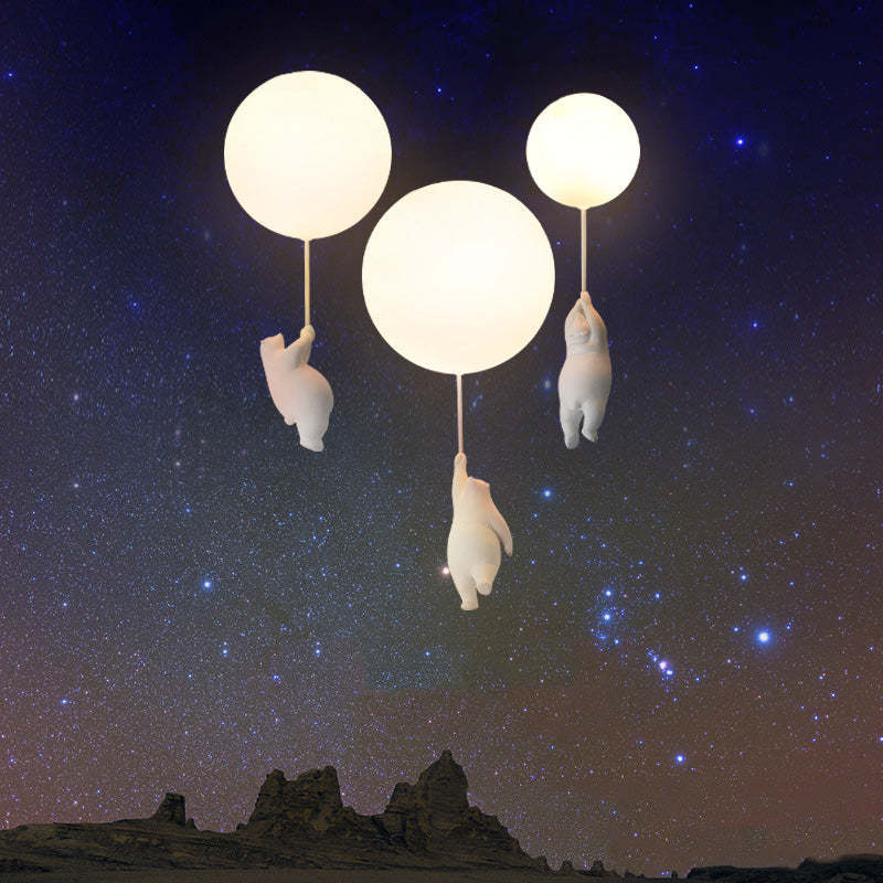 Three glowing bear balloon lights against a starry landscape montage
