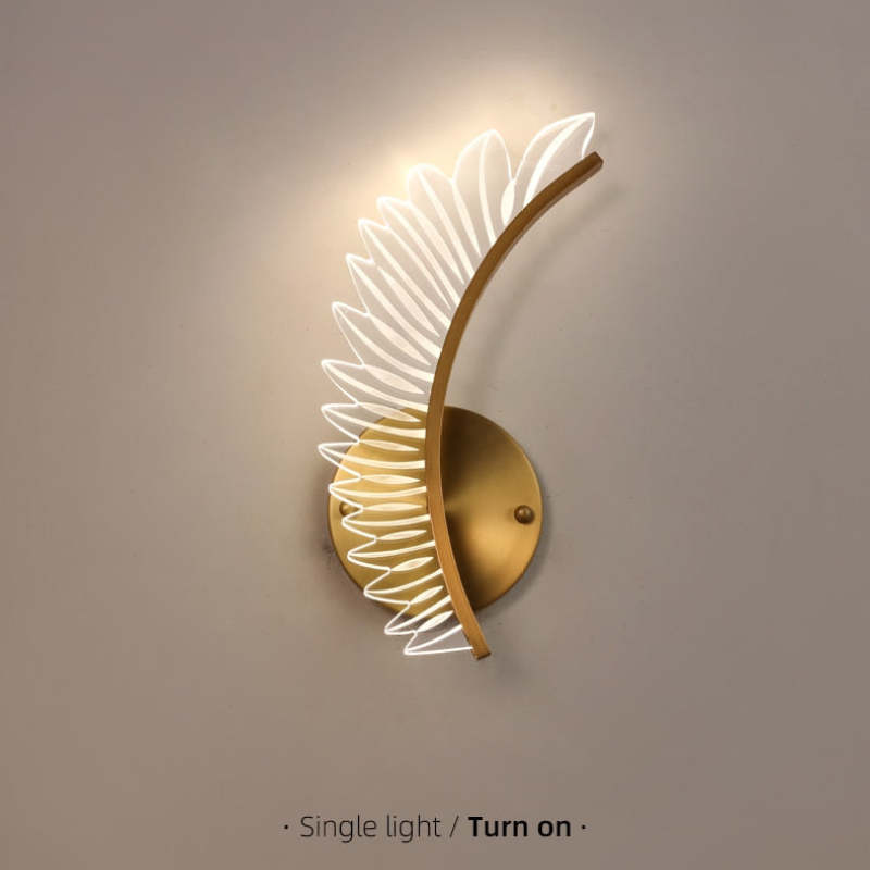 Lit Kristy single wing with curved gold-tone spine and round plate, labelled Single light and Turn on