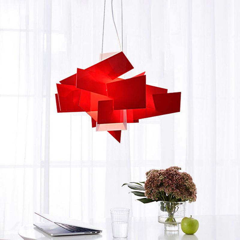 Red layered pendant beside a bright window