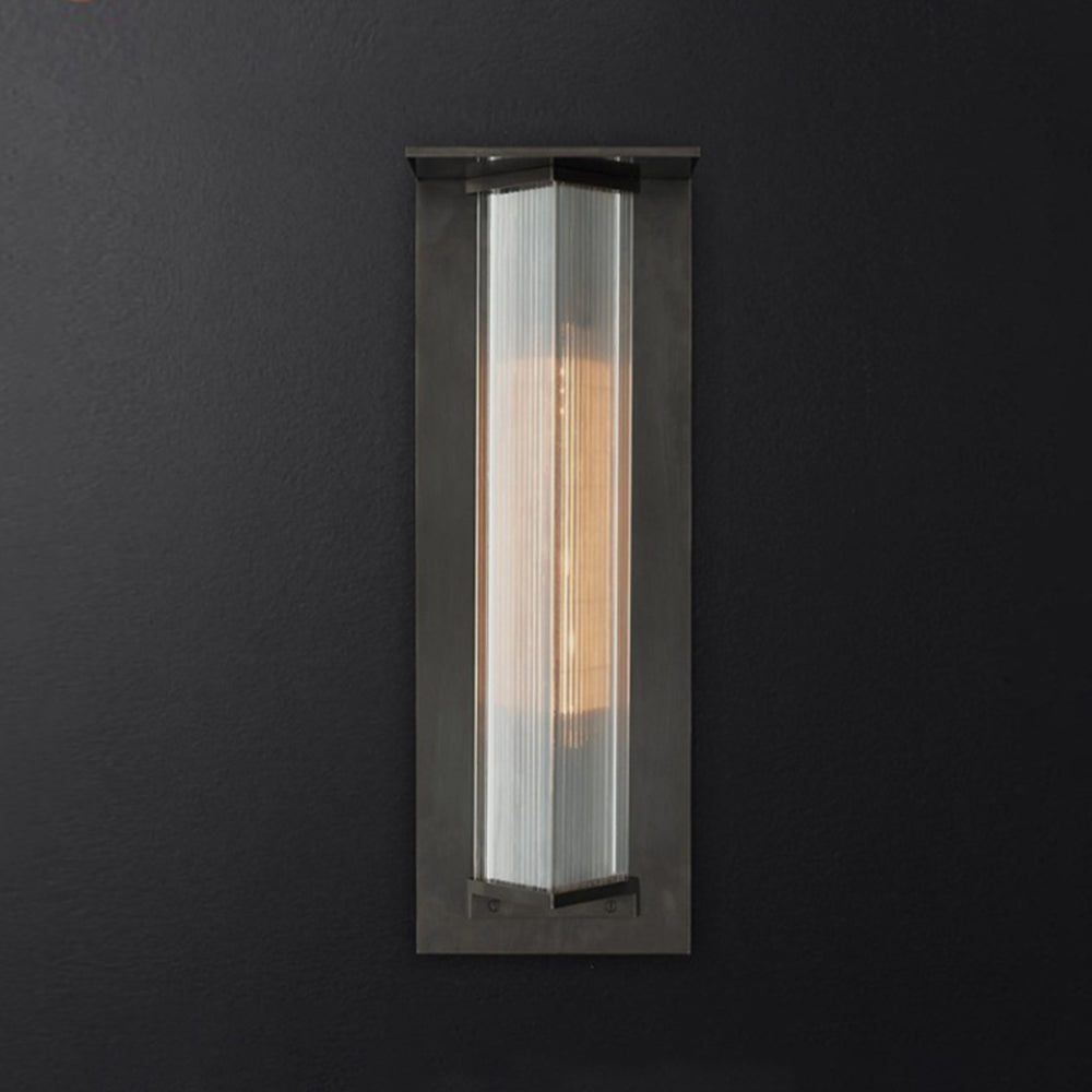 Unlit tall black Orr wall lamp on dark wall