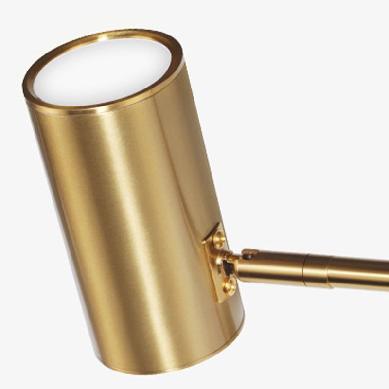 Freja close cylindrical gold-tone shade with pale circular end and side joint