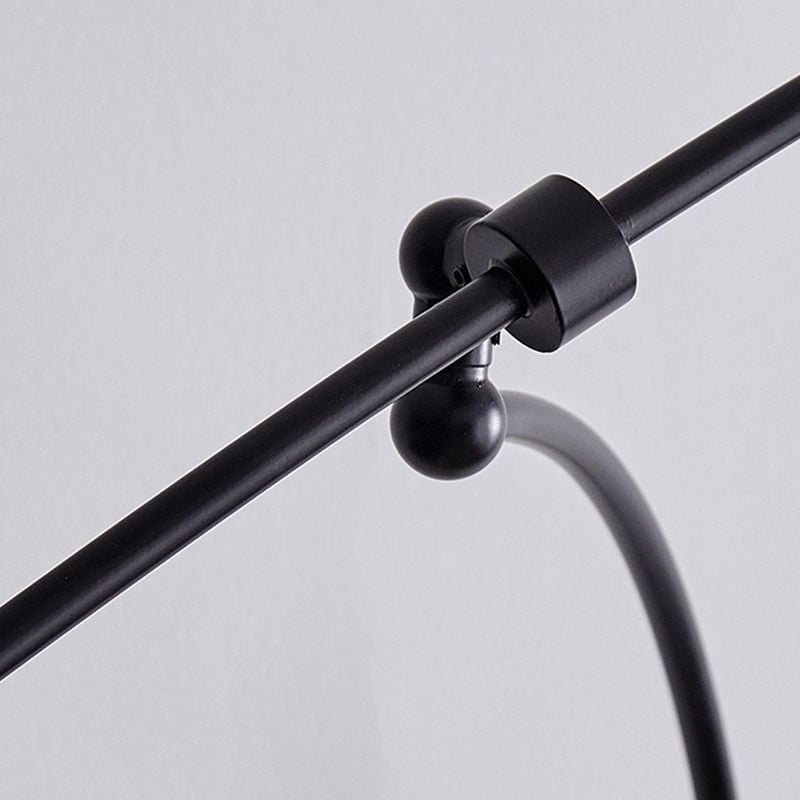 Carins close black rod clamp and rounded joint where the curved lower support meets the arc arm