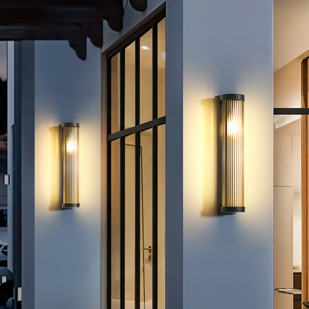 Tall Orr wall lamps beside glazed doors