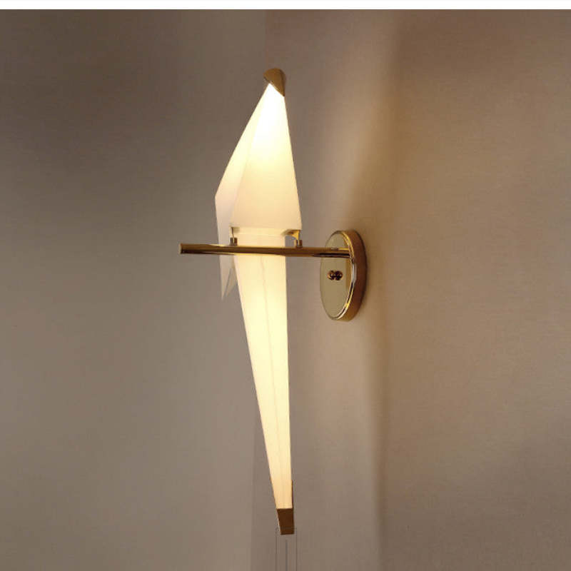 Front-side view of a single illuminated Clifford bird on a short perch extending from a round wall plate