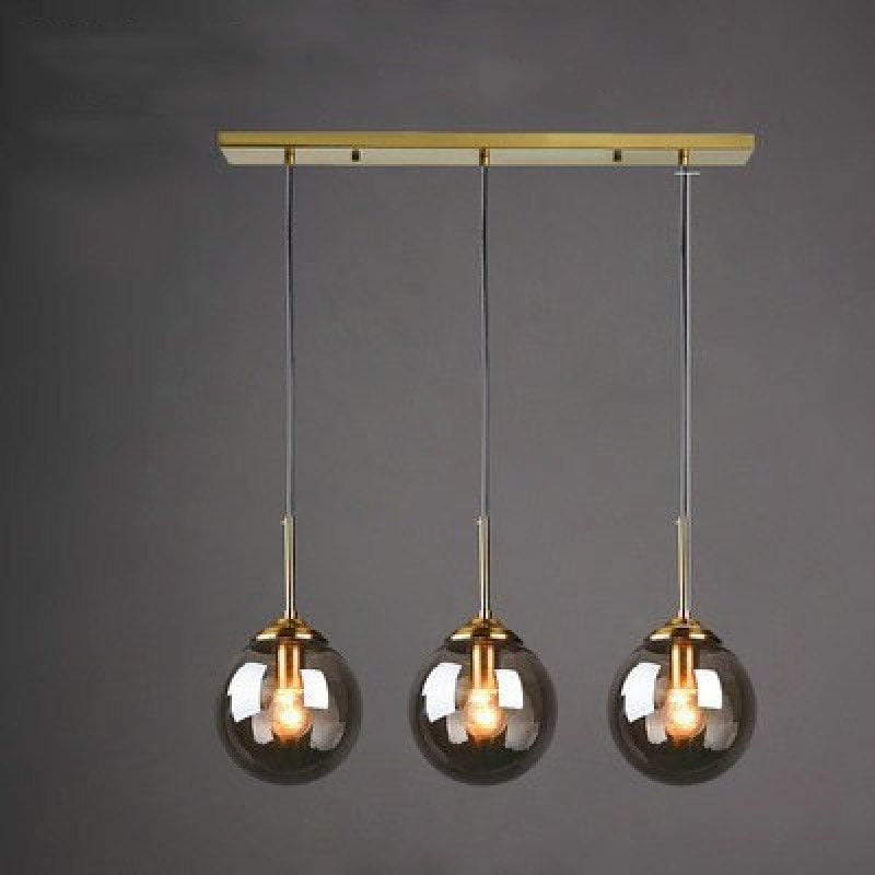 Valentina Smoke Glass three-light pendant on a rectangular gold-tone canopy