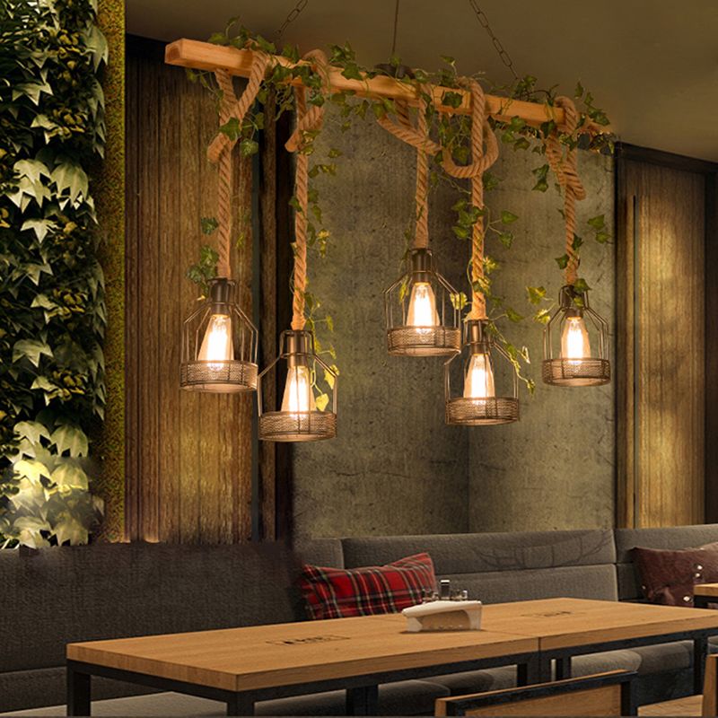 Five-light Alessio wood-beam pendant above a long wooden table and bench.
