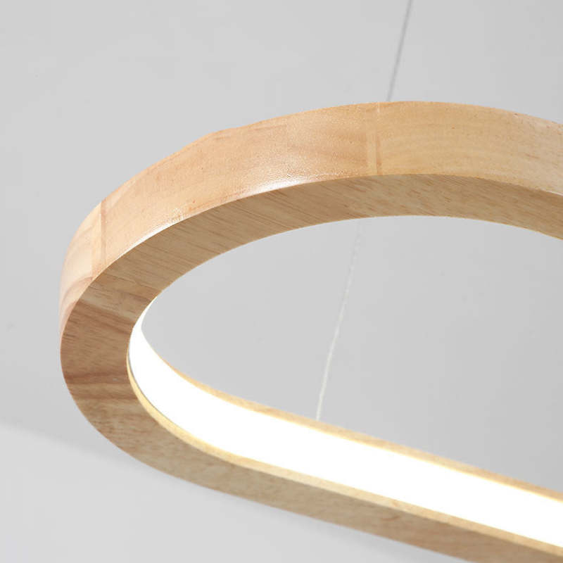 Close view of curved wood-toned frame and LED light channel