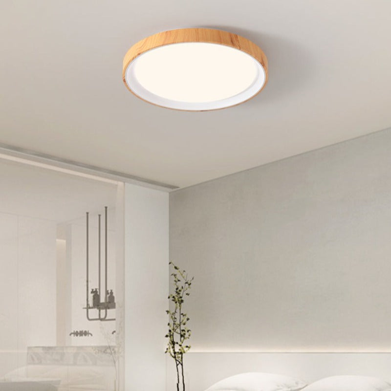 Light wood-tone and white Quinn ceiling light in a pale room