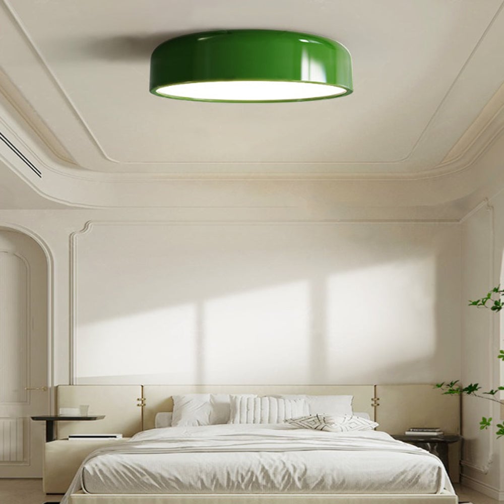 Green Morandi ceiling light above a white bed