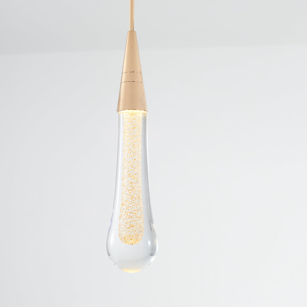 Close complete Hailie teardrop with a tapered gold-tone cap and illuminated textured inner element