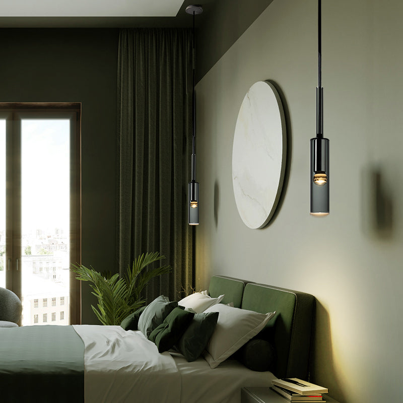 Sanna black pendant beside a bed in a green bedroom