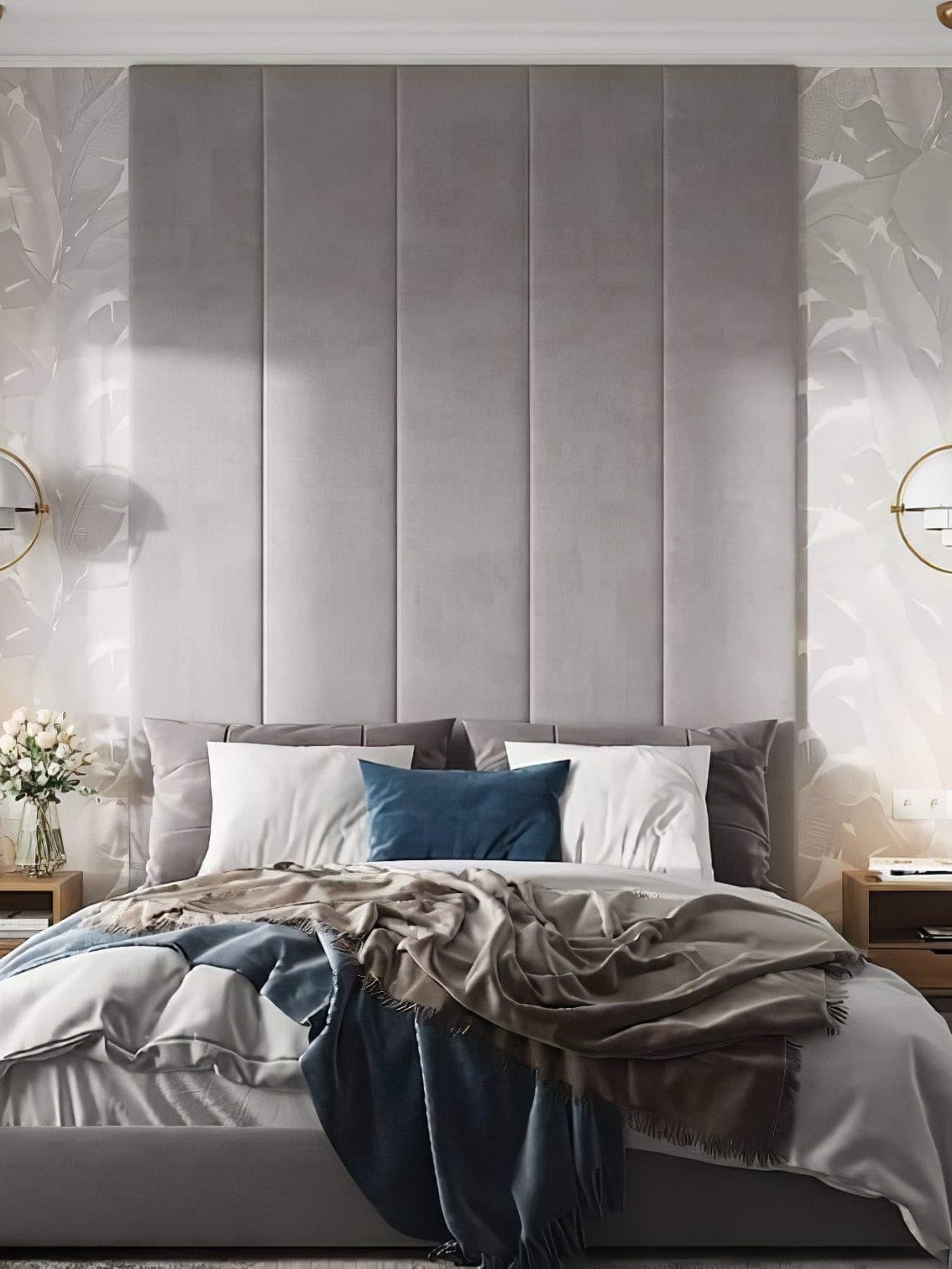 White rotating-shade pendants beside a bed