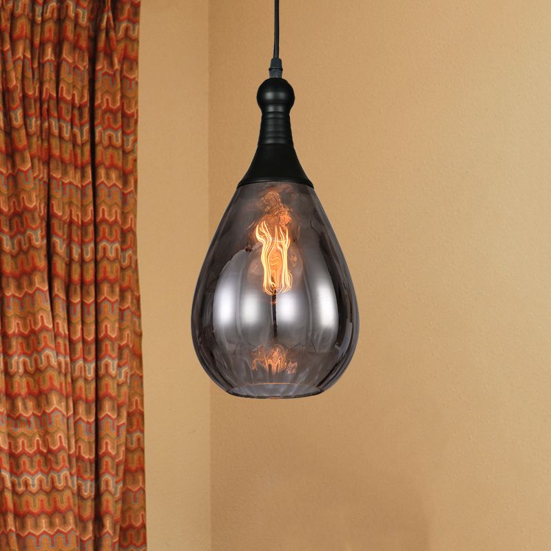 Avi Black-Smoke Gray teardrop pendant near patterned curtains