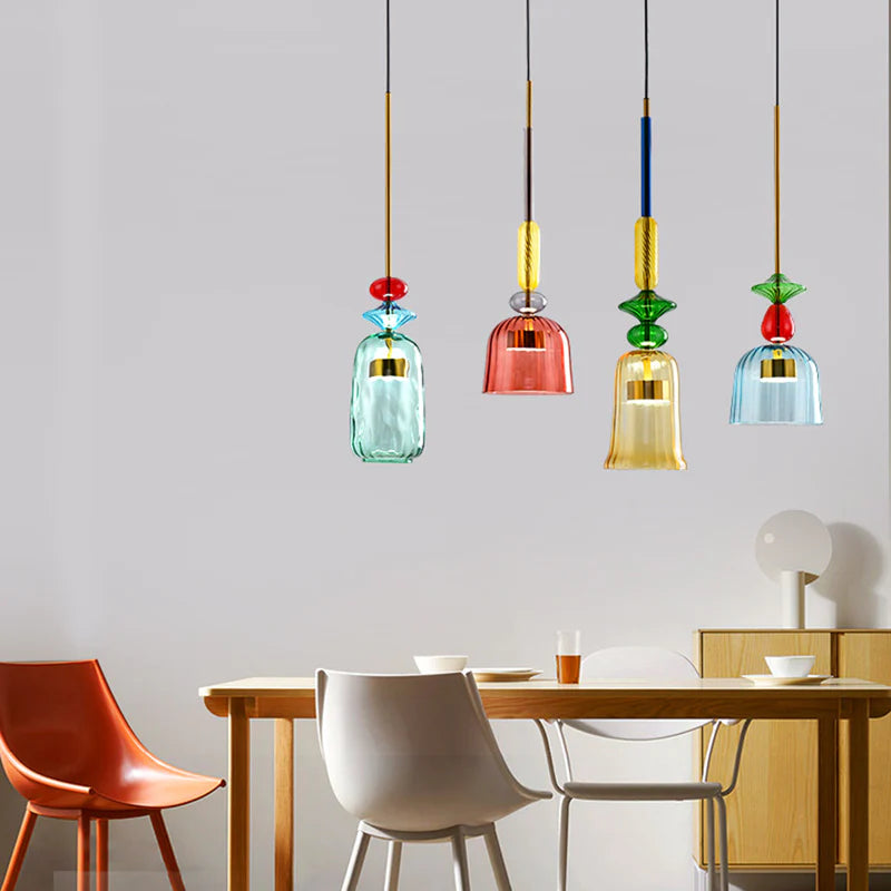 Four different glass pendants above dining table