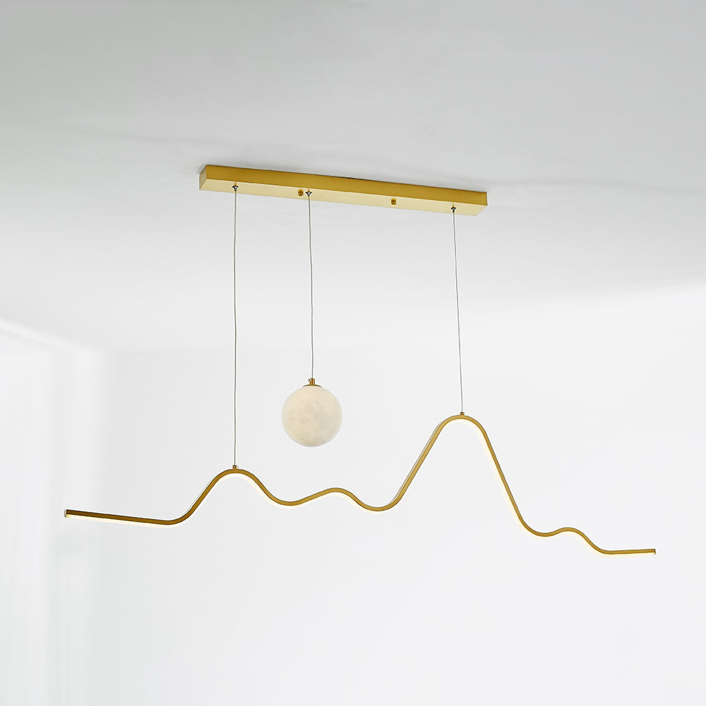 Gold wave and globe shown together with suspension wires
