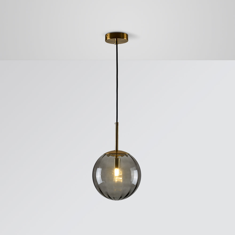 Gray tinted glass globe with glowing bulb, gold-tone stem, round canopy and black cord against Gray