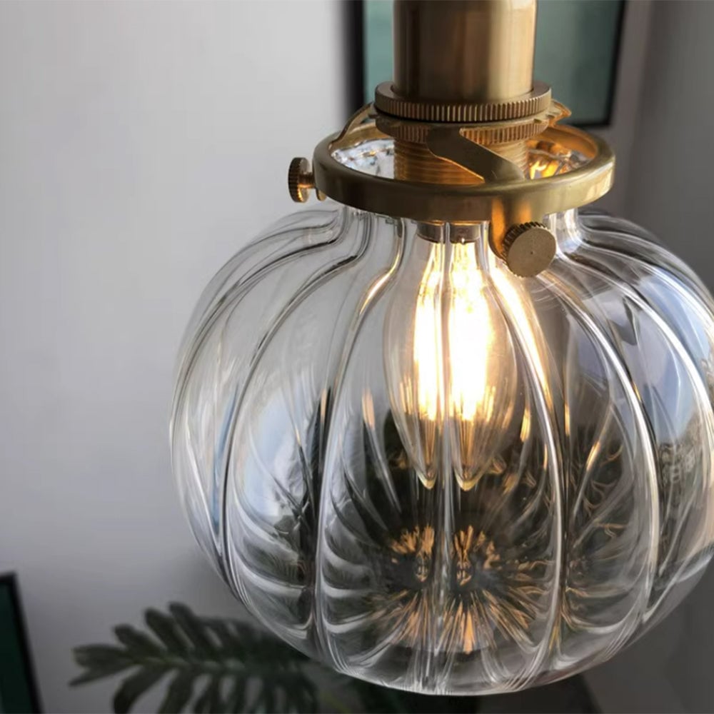 Close clear ribbed glass shade with visible decorative bulb