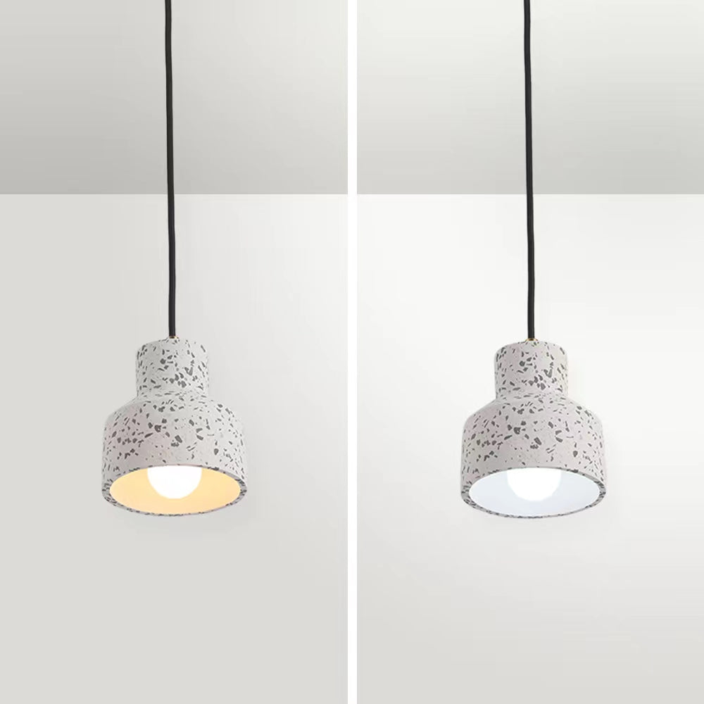 White Morandi speckled cement pendant composite with warm and white bulb illumination under the open shade